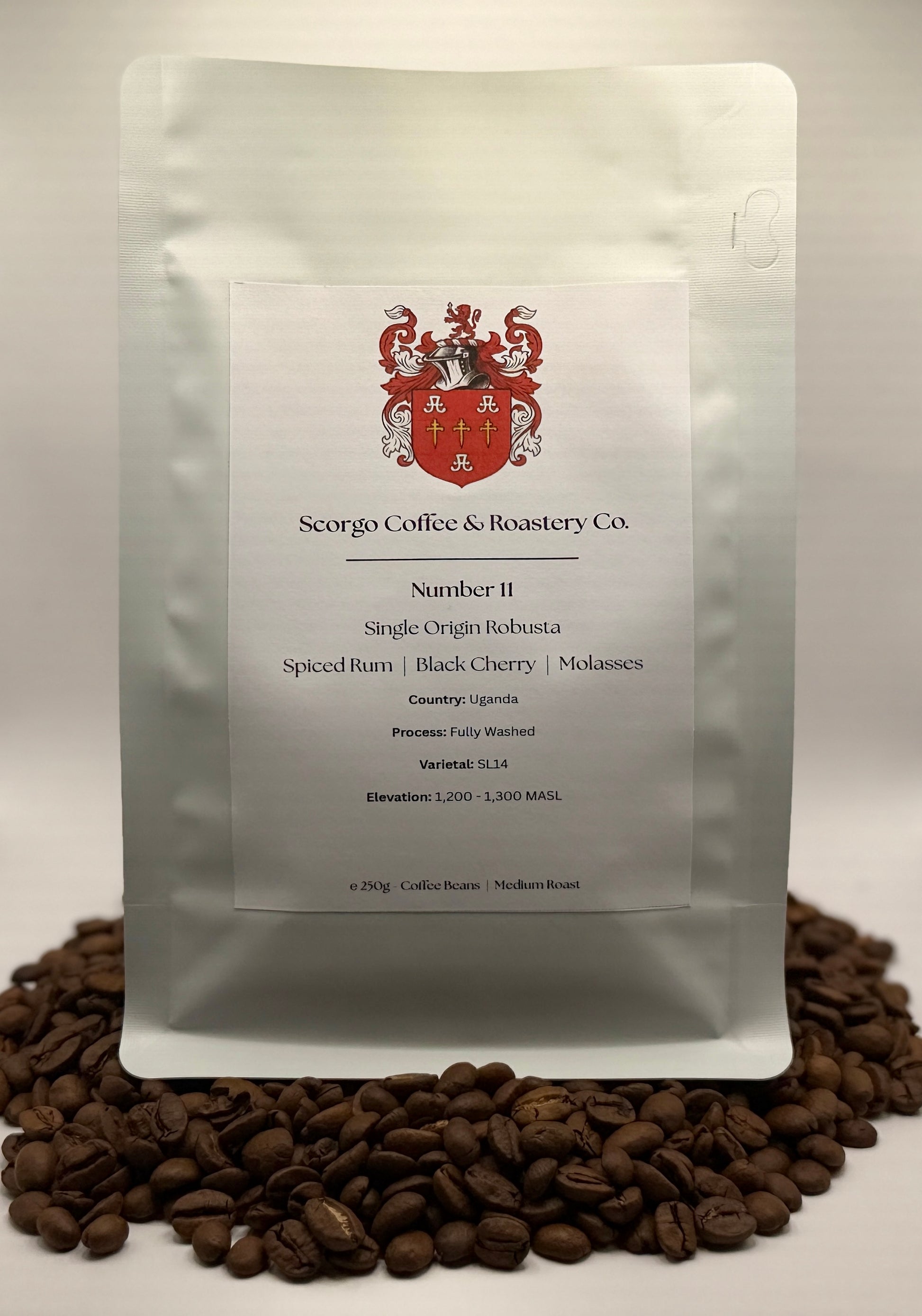 Scorgo coffee Number 11 single origin robusta ground coffee from uganda. Flavour notes include spiced rum, black cherry and molasses. Fully washed coffee from a UK-based family run coffee roastery.