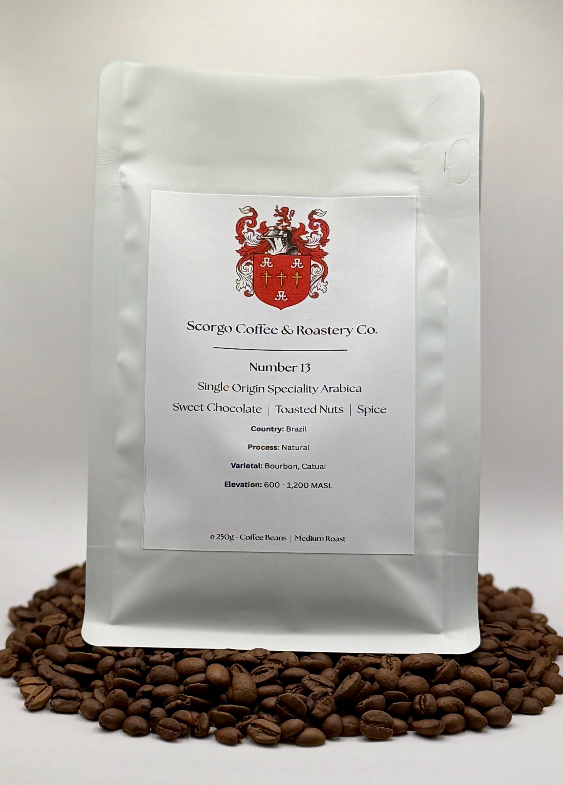 Scorgo coffee Number 13 single origin arabica ground coffee from Brazil. Flavour notes include sweet chocolate, toasted nuts and spice. Naturally processed specialty coffee from a UK-based family run coffee roastery.