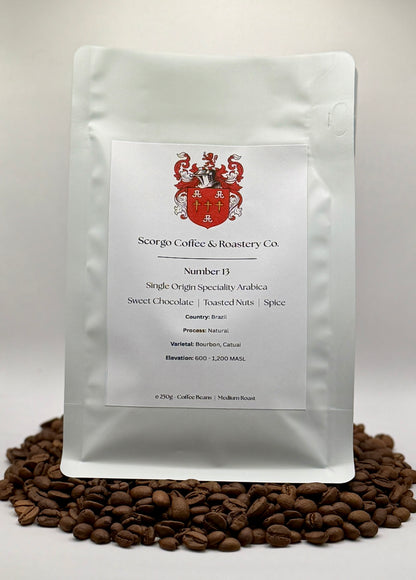 Scorgo coffee Number 13 single origin arabica ground coffee from Brazil. Flavour notes include sweet chocolate, toasted nuts and spice. Naturally processed specialty coffee from a UK-based family run coffee roastery.
