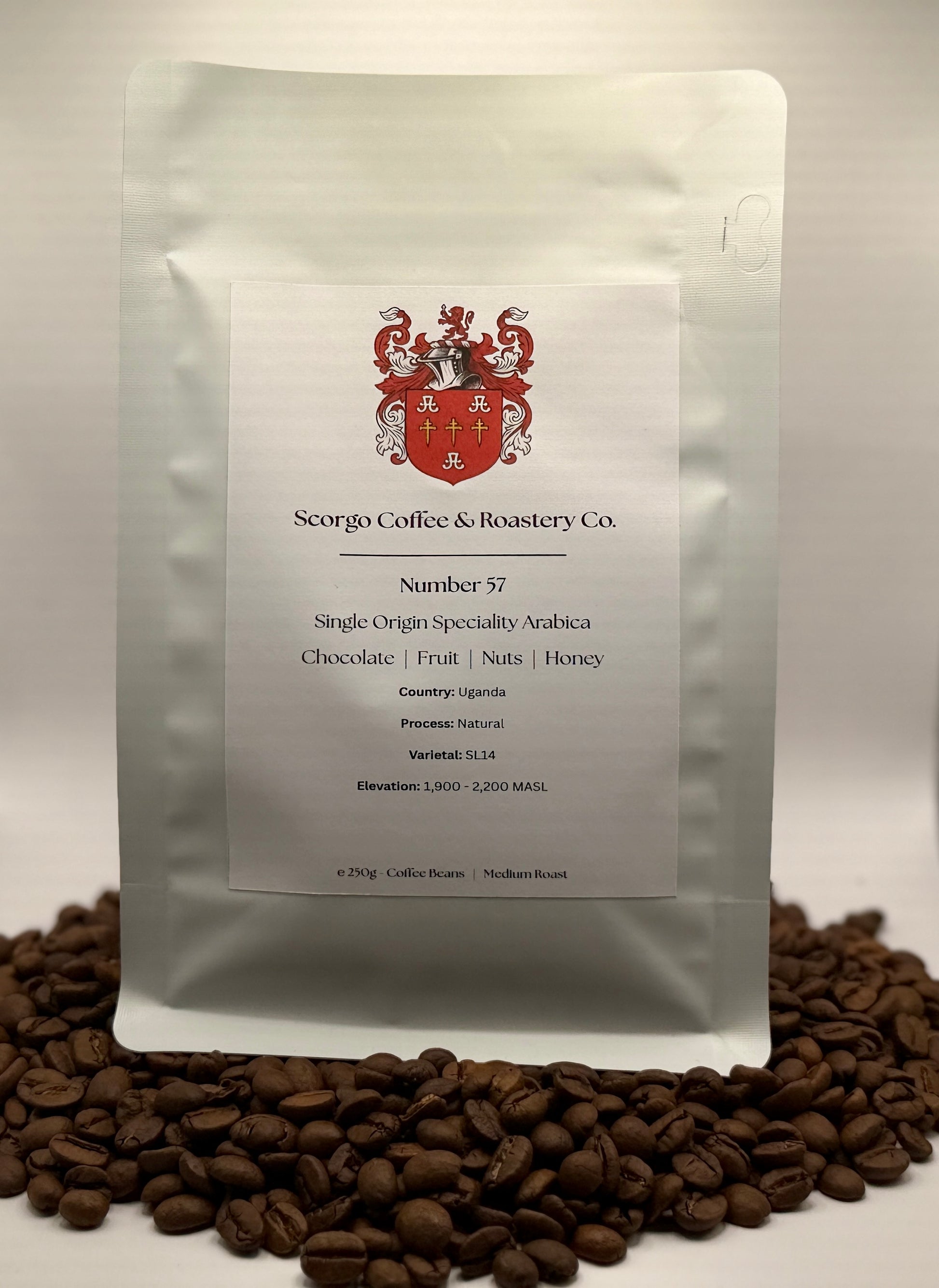 Scorgo coffee Number 57 single origin arabica ground coffee from Uganda. Flavour notes include chocolate, fruit, nuts and honey. Natural processed specialty coffee from a UK-based family run coffee roastery.