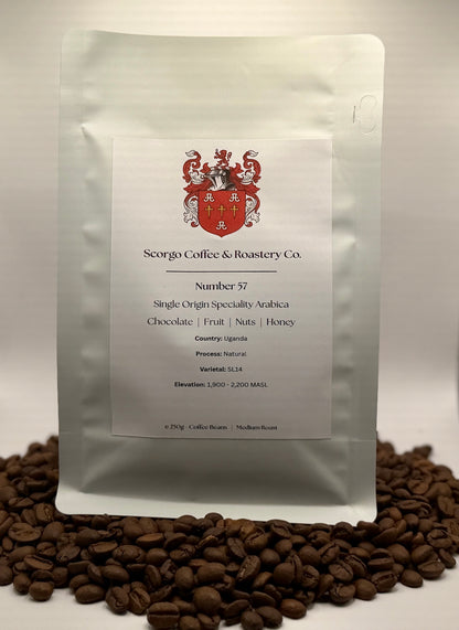Scorgo coffee Number 57 single origin arabica ground coffee from Uganda. Flavour notes include chocolate, fruit, nuts and honey. Natural processed specialty coffee from a UK-based family run coffee roastery.