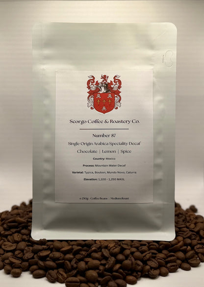 Scorgo coffee Number 87 single origin arabica decaf ground coffee from Mexico, Central America. Flavour notes include chocolate, lemon and spice. Mountain water decaf processed specialty coffee from a UK-based family run coffee roastery.